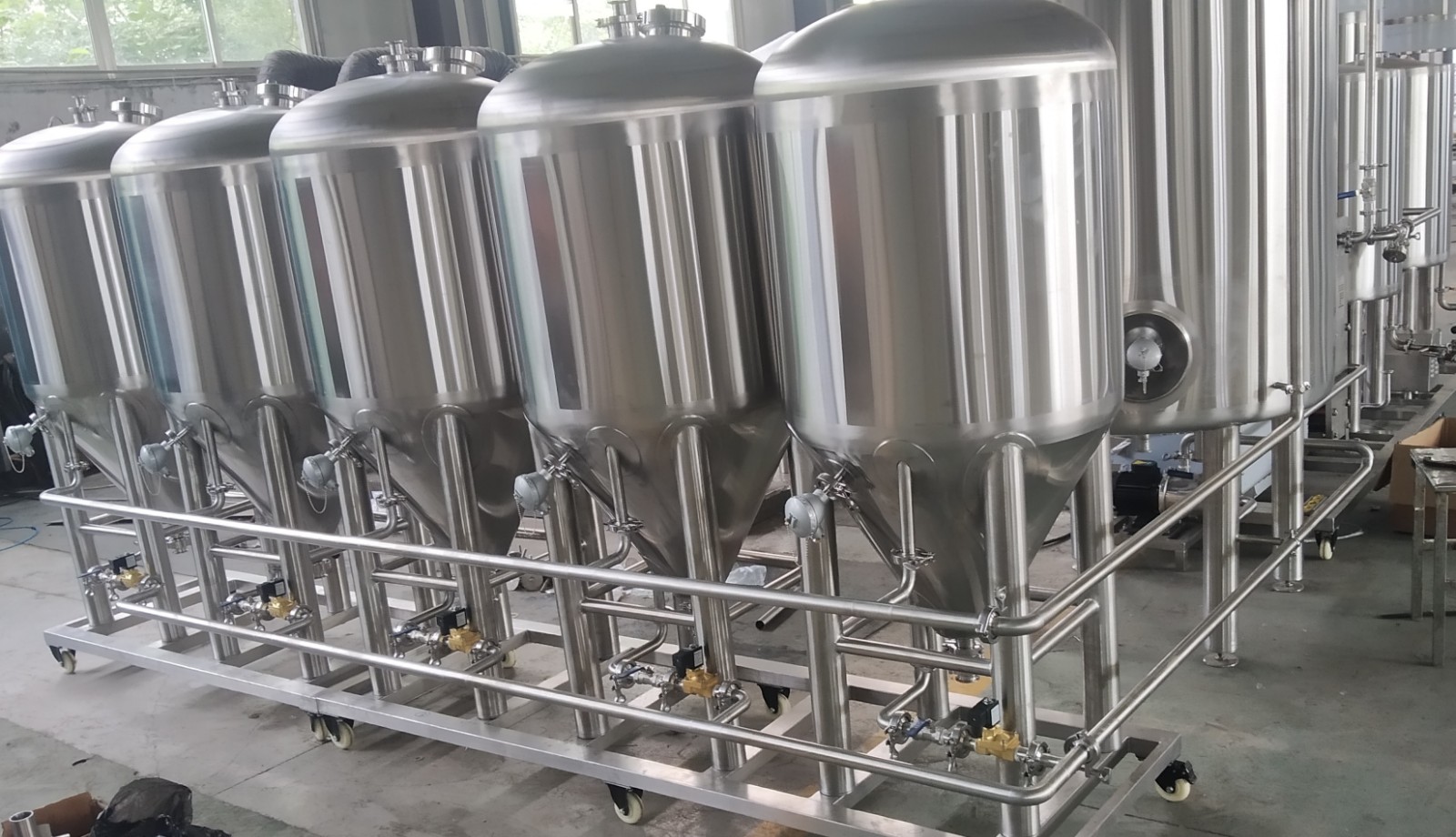 100 beer brewing fermentation tanks.jpg